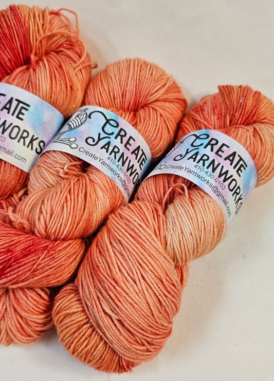 Broken Peach in Gold Sparkle Superwash Merino Blend Fingering Weight Yarn