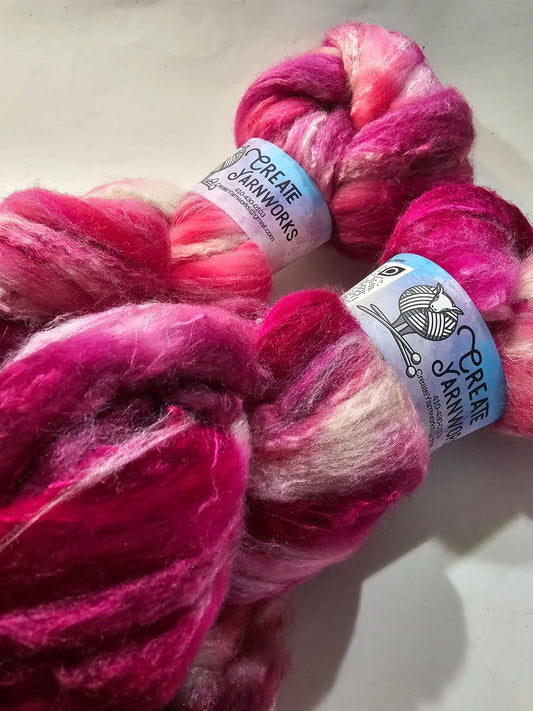 Pretty in Pink in Merino/Tussah Silk 70/30 blend Top 4oz braid