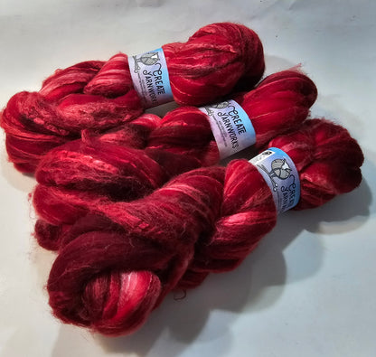 Ragin Red in Merino/Tussah Silk 70/30 blend Top 4oz braid