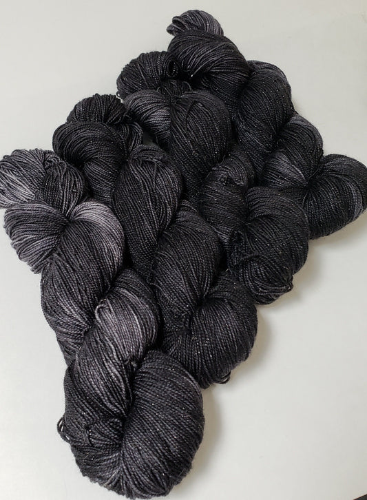 Almost Black in Gold Sparkle Superwash Merino Blend Fingering Weight Yarn